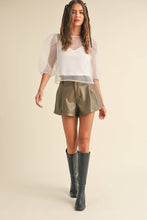 Load image into Gallery viewer, Faux leather fabric in olive
High waist with belt loops and front pleating
Front zip closure
faux leather shorts 
vegan shorts 
vegan leather 