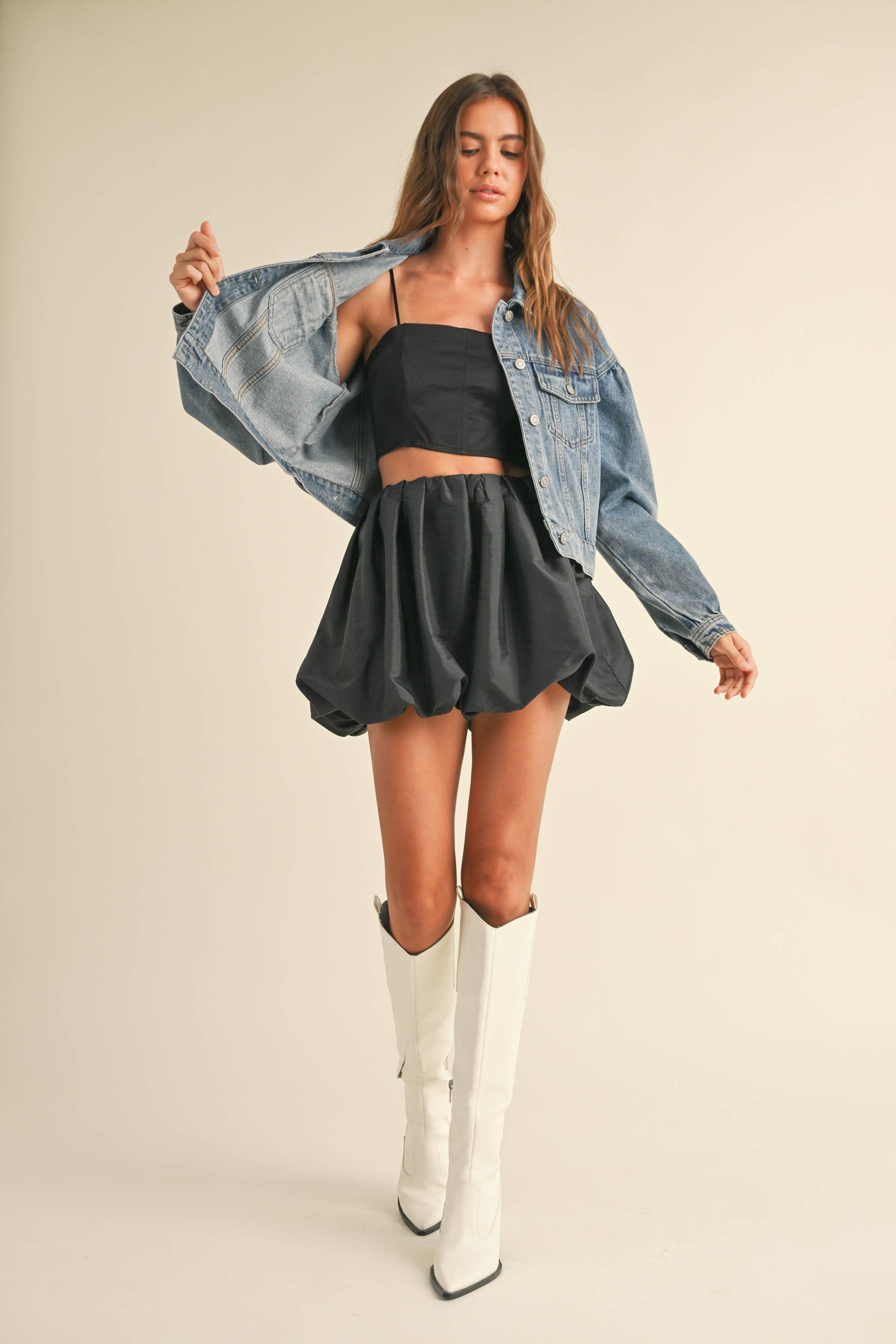 The Aimee was made to party! Pair it with a tee to dress it down or throw it on with your favorite sweater and tights for a holiday party

Metallic fabric
Balloon hem style
Mini length
Zip closure
Dry clean
True to size
Model is 5'8" and wearing a Small