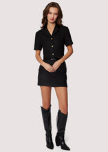 Load image into Gallery viewer, Woven boucle fabric
Fitted silhouette
Chic croc pleather accents at the waistline and pockets
Side pockets
Back zip closure
Mini length
black mini skirt
chanel inspired set 
matching set
skirt and top set
