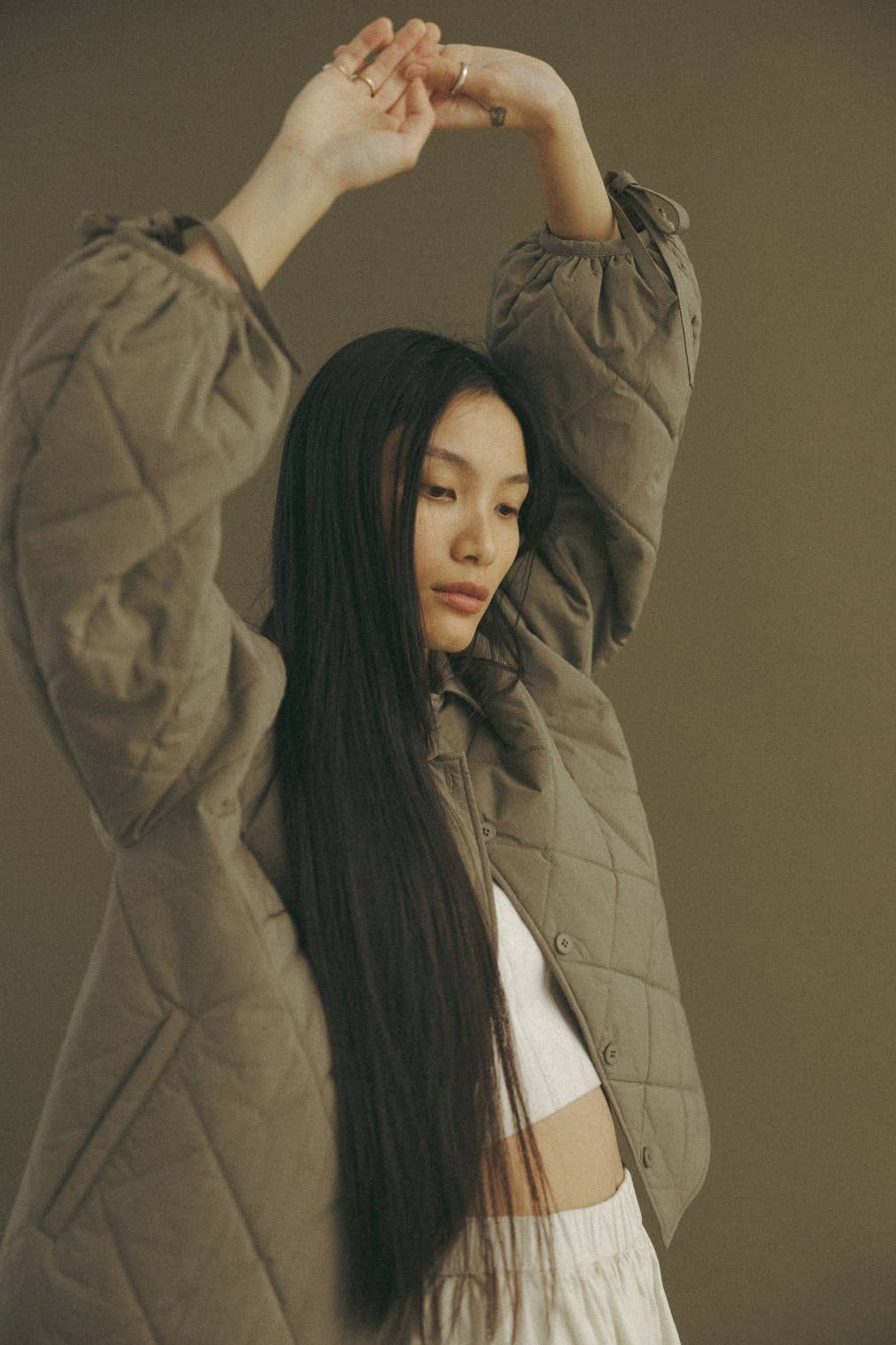 oversized button-down jacket featuring front welt pockets and drop shoulders for a relaxed silhouette. The keyhole with tie closure at the sleeves adds a touch of versatility, while the spread collars and a regular length create a modern, effortlessly chic look.